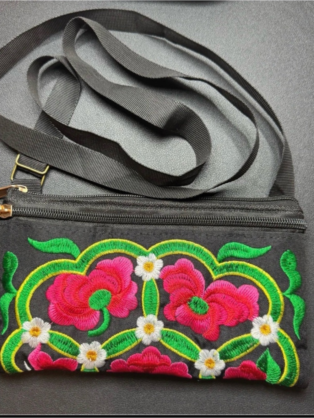 Embroidered Crossbody bag with ribbon strap.
